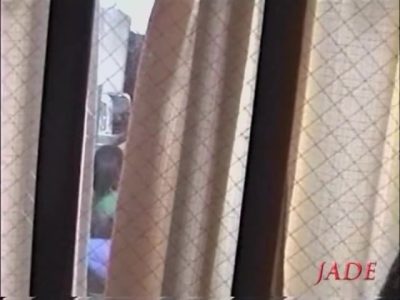 Busty Jap whore seen fucking hard through a window
