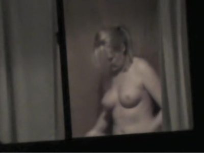 Topless bimbo is kinkily through the window